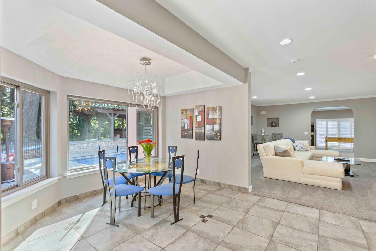 23491 Summit Road Los Gatos, CA 95033 - Photo 19 of 77 a dining room with furniture a chandelier and window