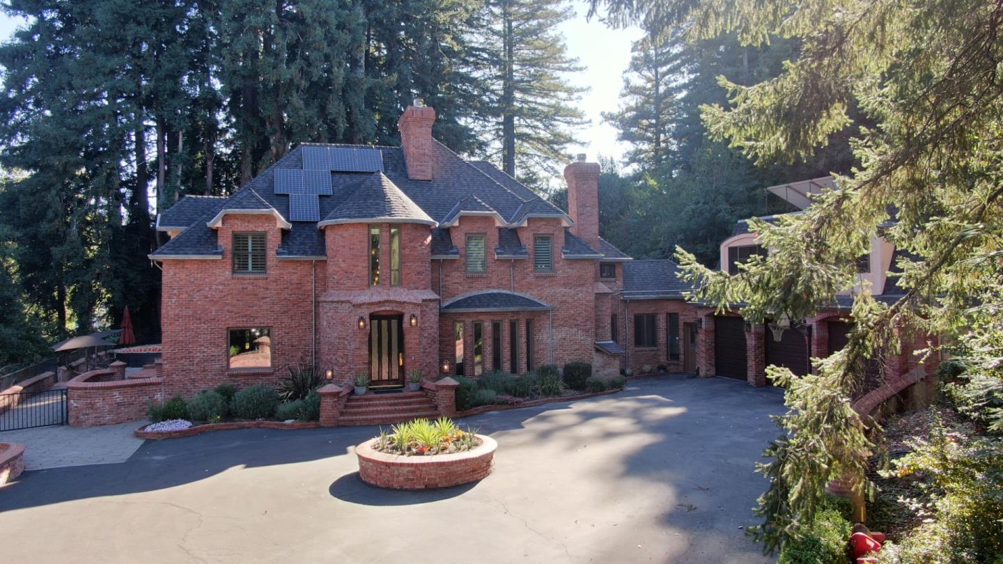 23491 Summit Road Los Gatos, CA 95033 - Photo 2 of 77 a front view of a house with a yard and a garden