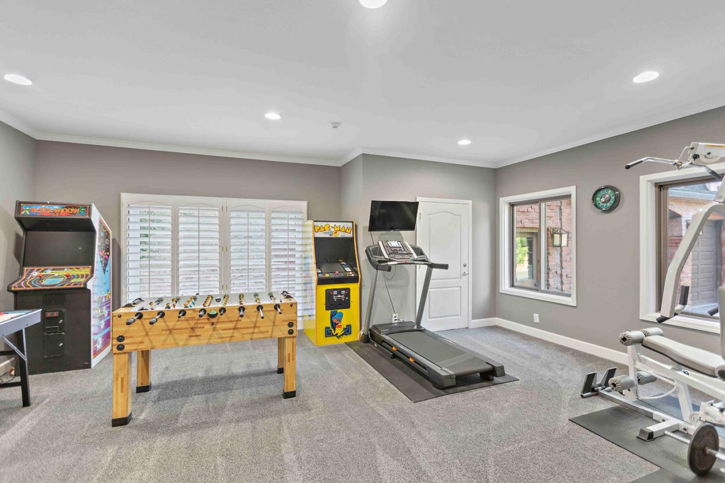 23491 Summit Road Los Gatos, CA 95033 - Photo 29 of 77 a living room with furniture a window and gym equipment