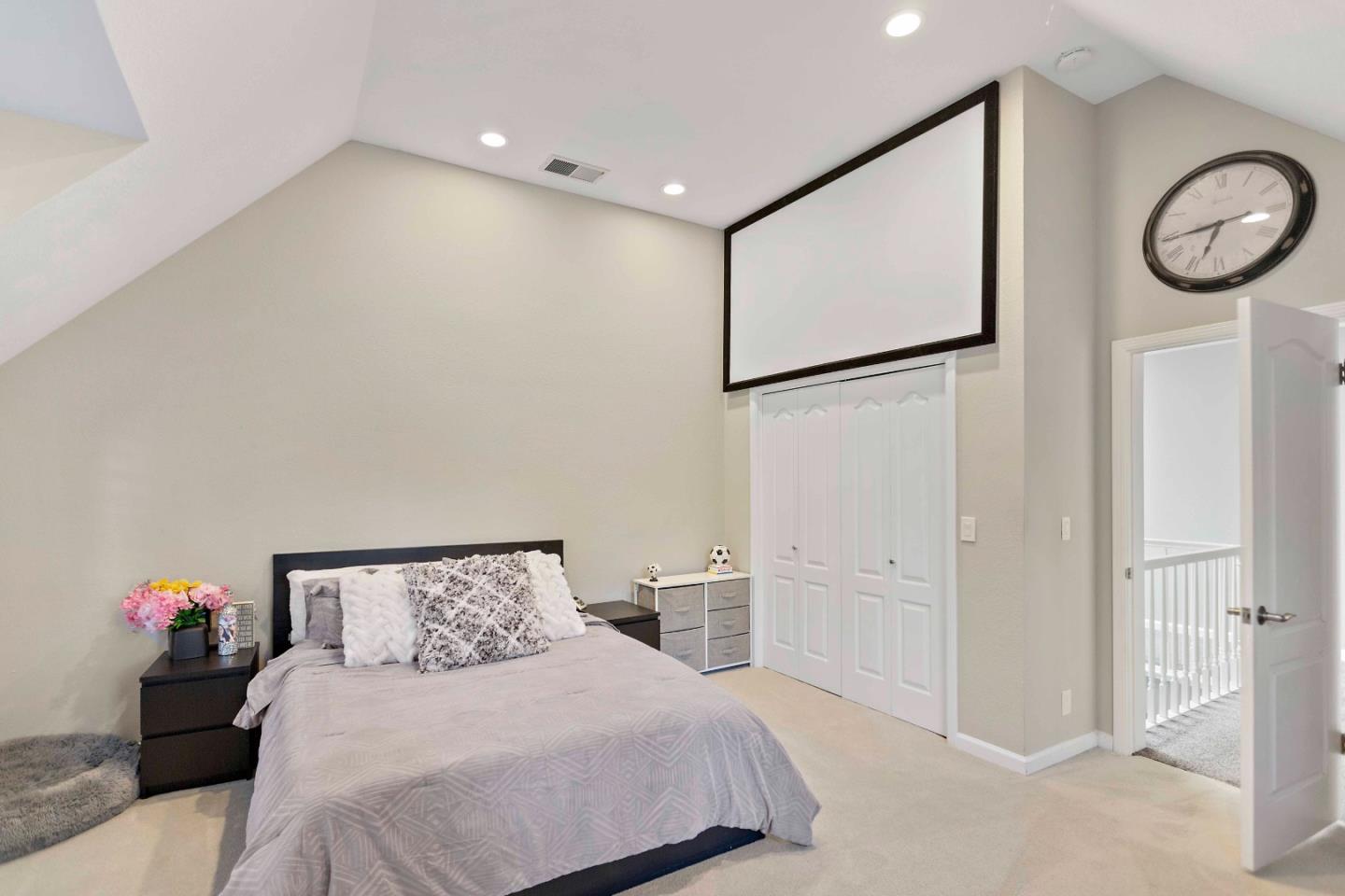 23491 Summit Road Los Gatos, CA 95033 - Photo 34 of 77 a bedroom with a bed and a chandelier