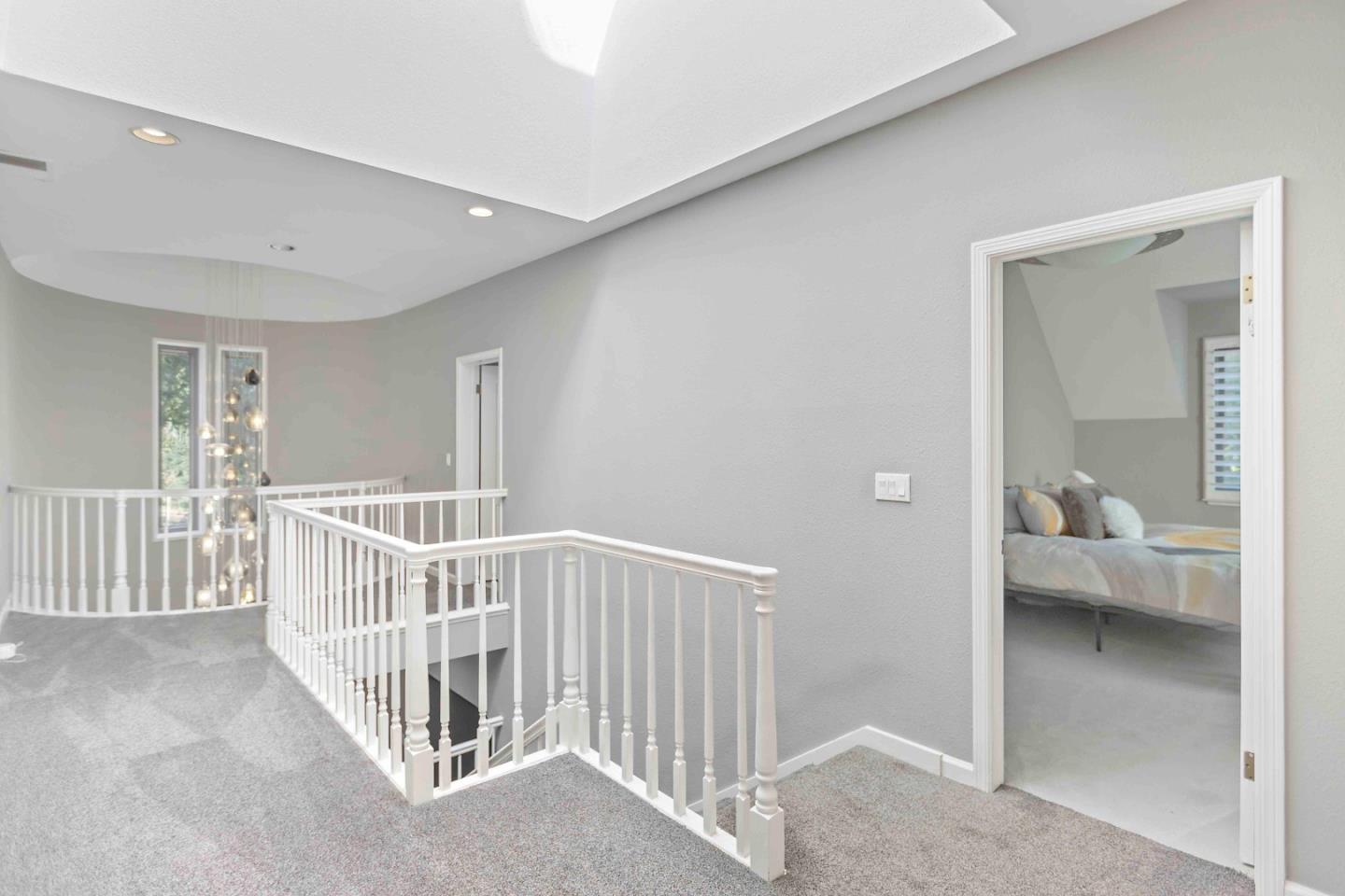 23491 Summit Road Los Gatos, CA 95033 - Photo 38 of 77 a view of a bedroom with wooden floor & windows