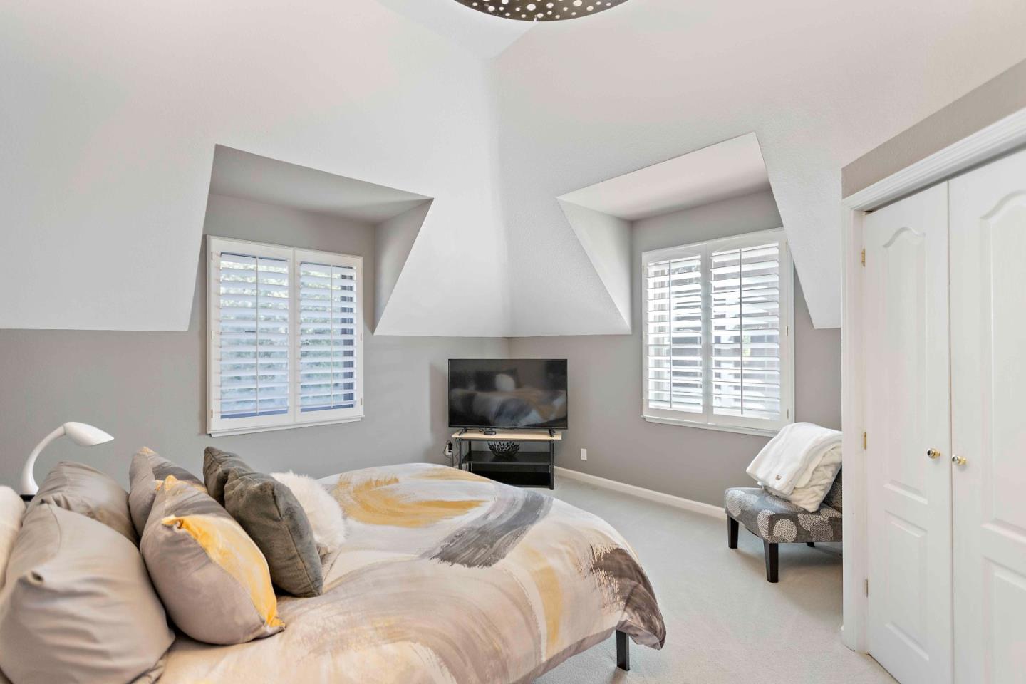 23491 Summit Road Los Gatos, CA 95033 - Photo 39 of 77 a bedroom with a bed and wooden floor