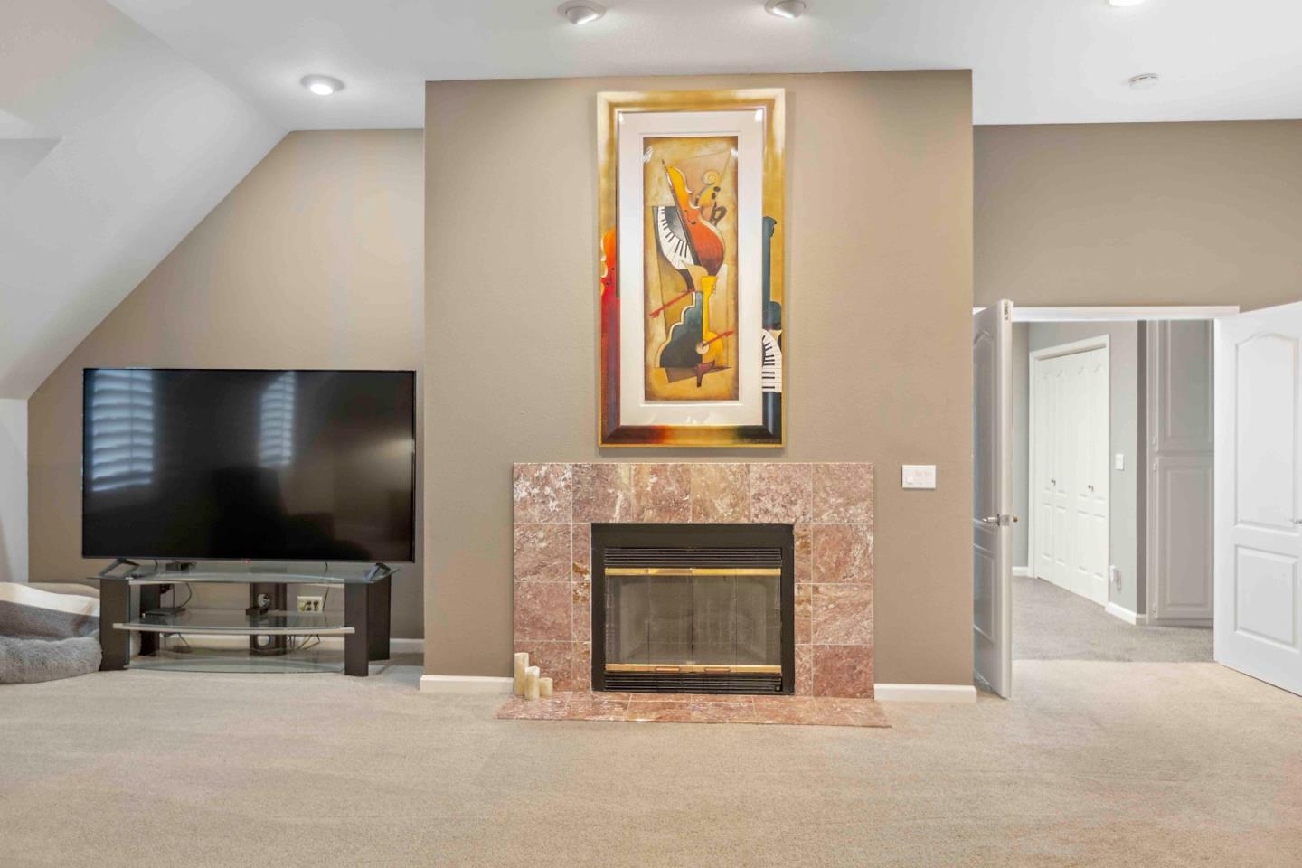 23491 Summit Road Los Gatos, CA 95033 - Photo 43 of 77 a living room with fireplace furniture and a flat screen tv