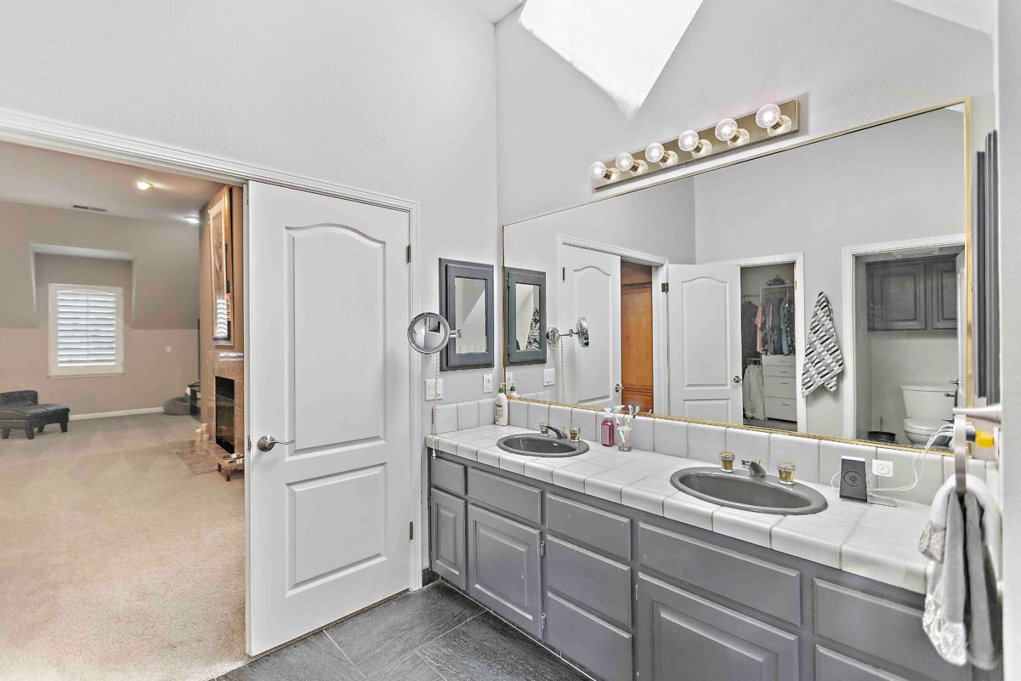 23491 Summit Road Los Gatos, CA 95033 - Photo 45 of 77 a bathroom with a sink and mirror