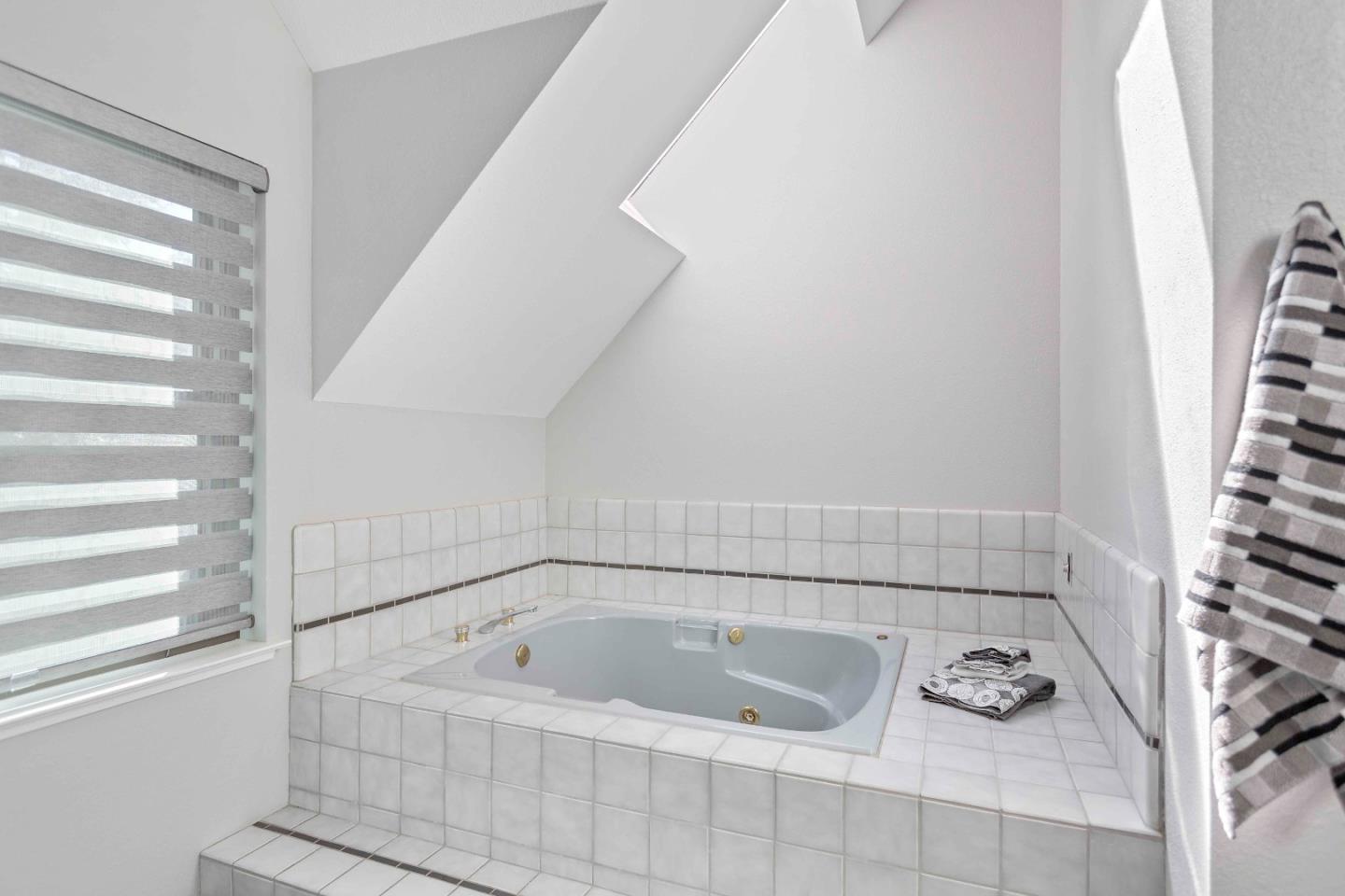 23491 Summit Road Los Gatos, CA 95033 - Photo 46 of 77 a bathroom with bathtub and window