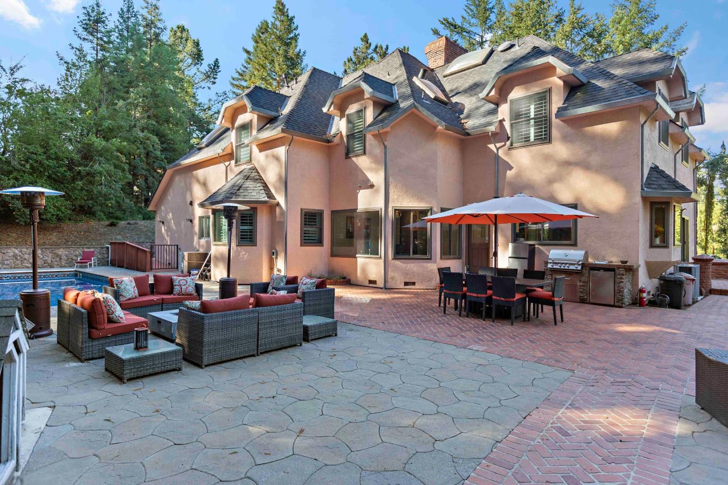 23491 Summit Road Los Gatos, CA 95033 - Photo 51 of 77 a view of a patio with a table and chairs under an umbrella