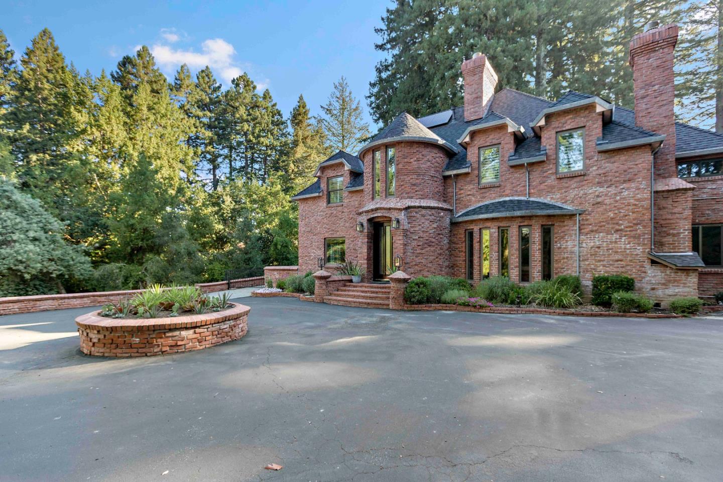23491 Summit Road Los Gatos, CA 95033 - Photo 6 of 77 a front view of a house with a yard