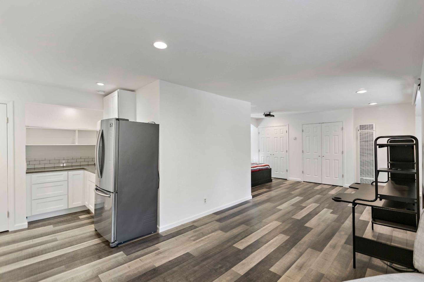 23491 Summit Road Los Gatos, CA 95033 - Photo 63 of 77 a kitchen with a refrigerator and a stove top oven