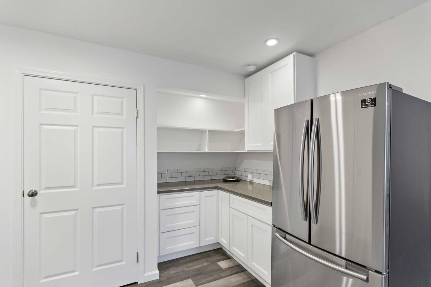 23491 Summit Road Los Gatos, CA 95033 - Photo 64 of 77 a kitchen with a refrigerator and cabinets