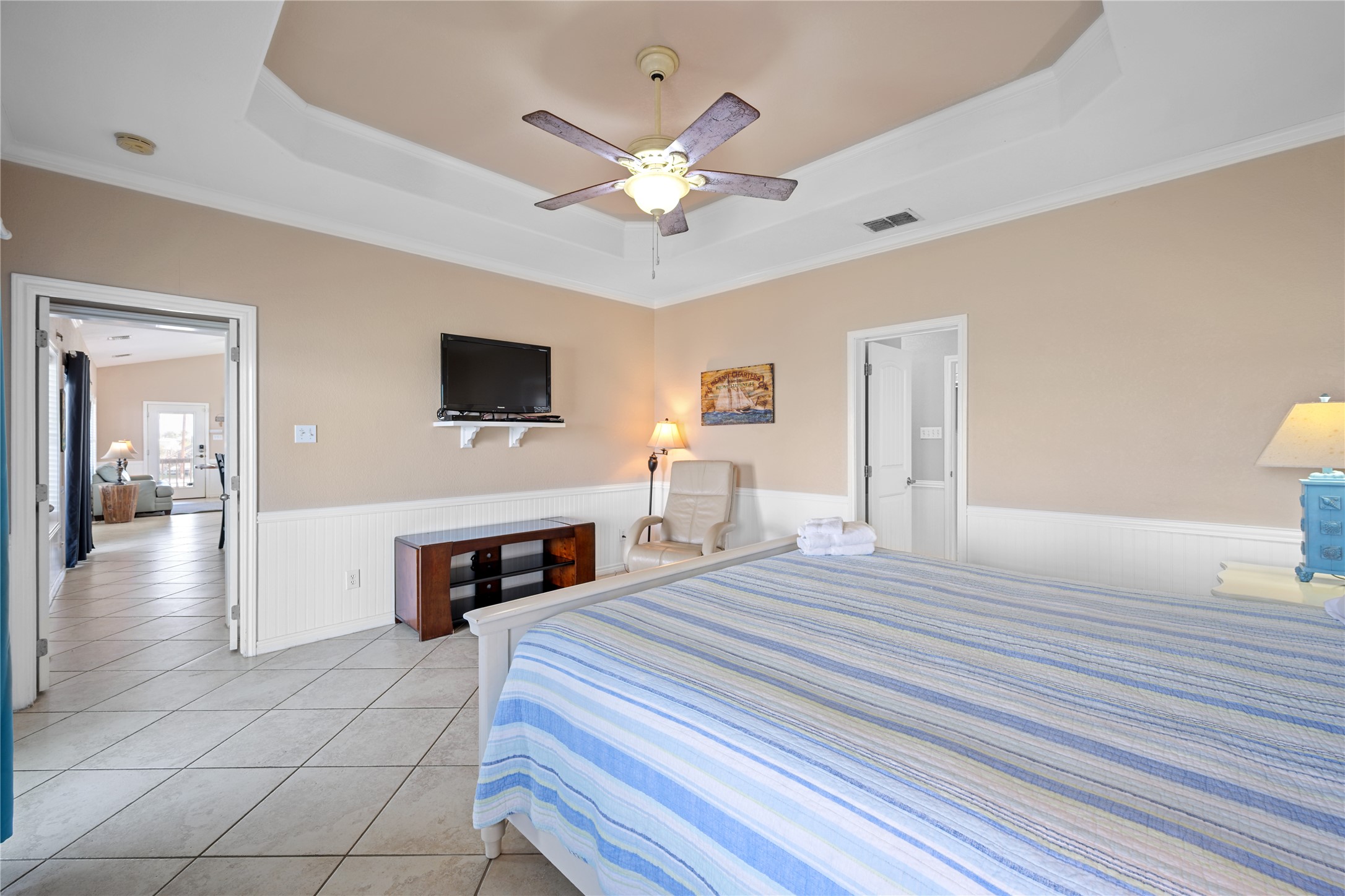 740 Copano Cove Road Rockport, TX 78382 - Photo 23 of 35 a bedroom with a bed and a fireplace