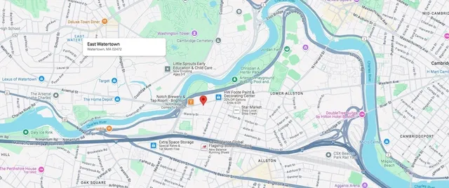 a view of a room with a white house and a bed