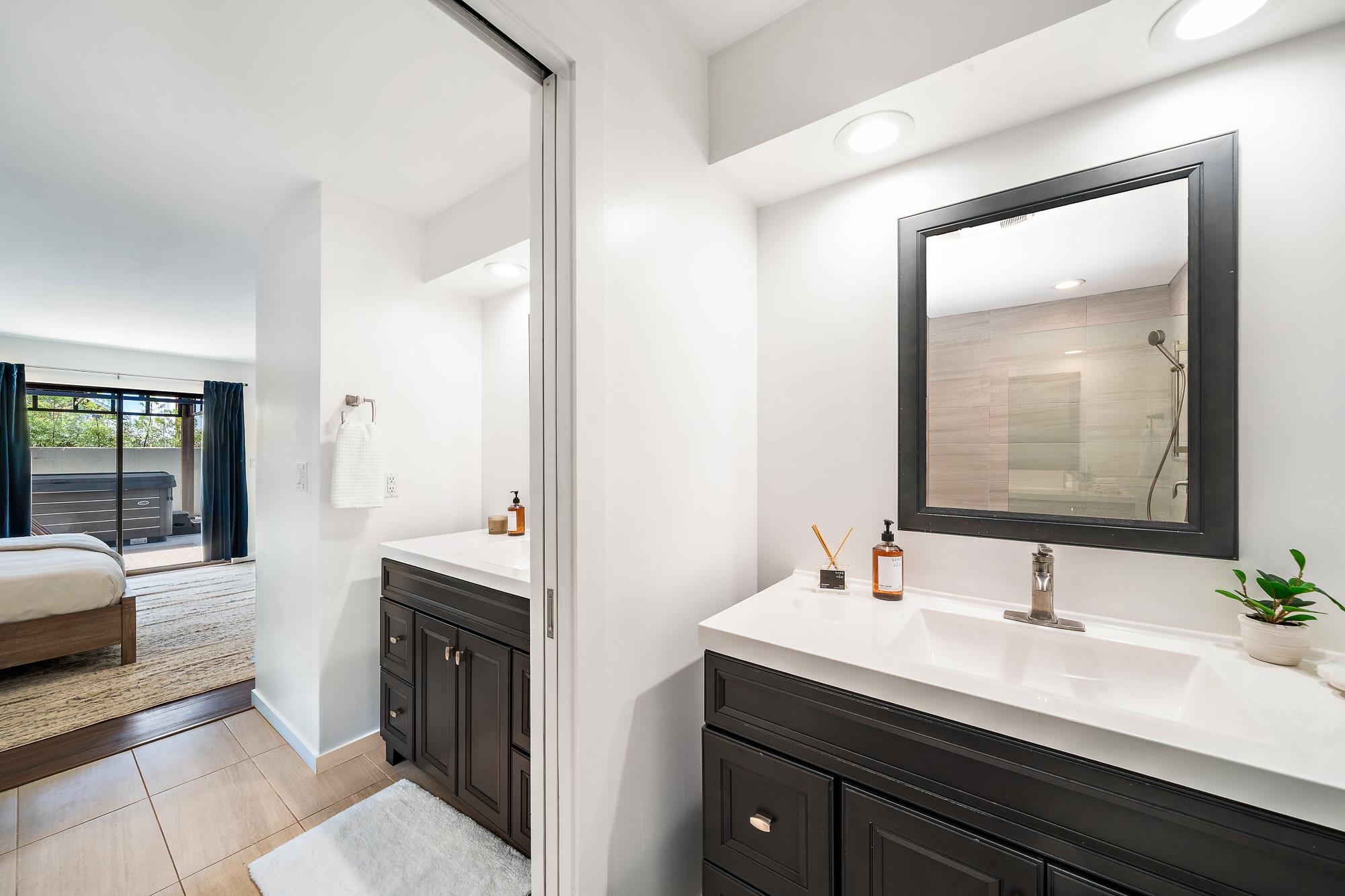 84 Mano Drive Kula, HI 96790 - Photo 11 of 25 a en suite bathroom with a double vanity sink and a mirror