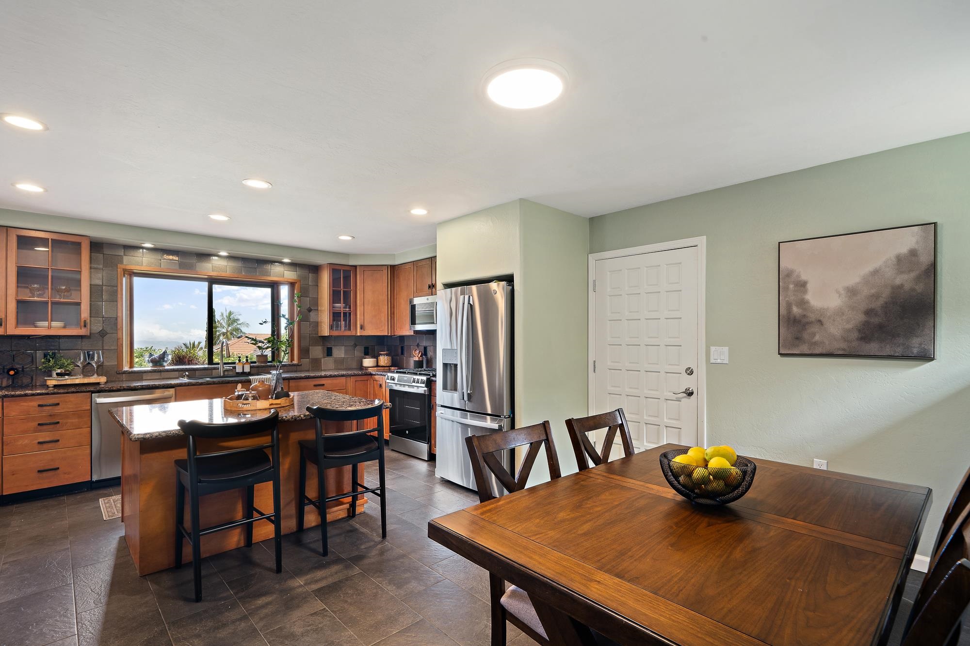 84 Mano Drive Kula, HI 96790 - Photo 13 of 25 a view of a dining room with furniture and window