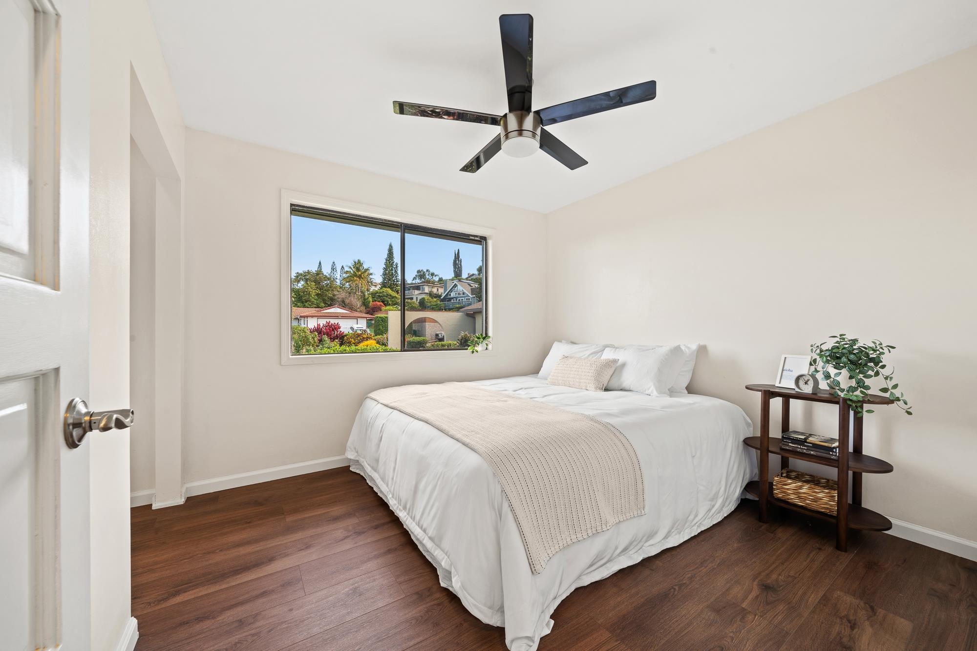84 Mano Drive Kula, HI 96790 - Photo 16 of 25 a bedroom with a bed and a painting on the wall