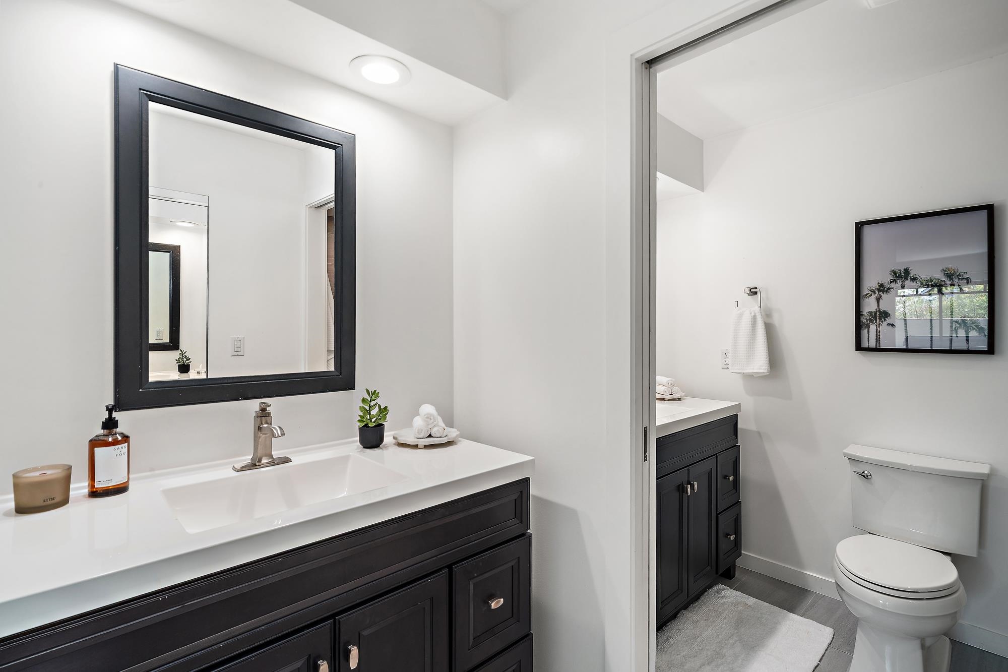 84 Mano Drive Kula, HI 96790 - Photo 9 of 25 a bathroom with a sink a toilet and a mirror