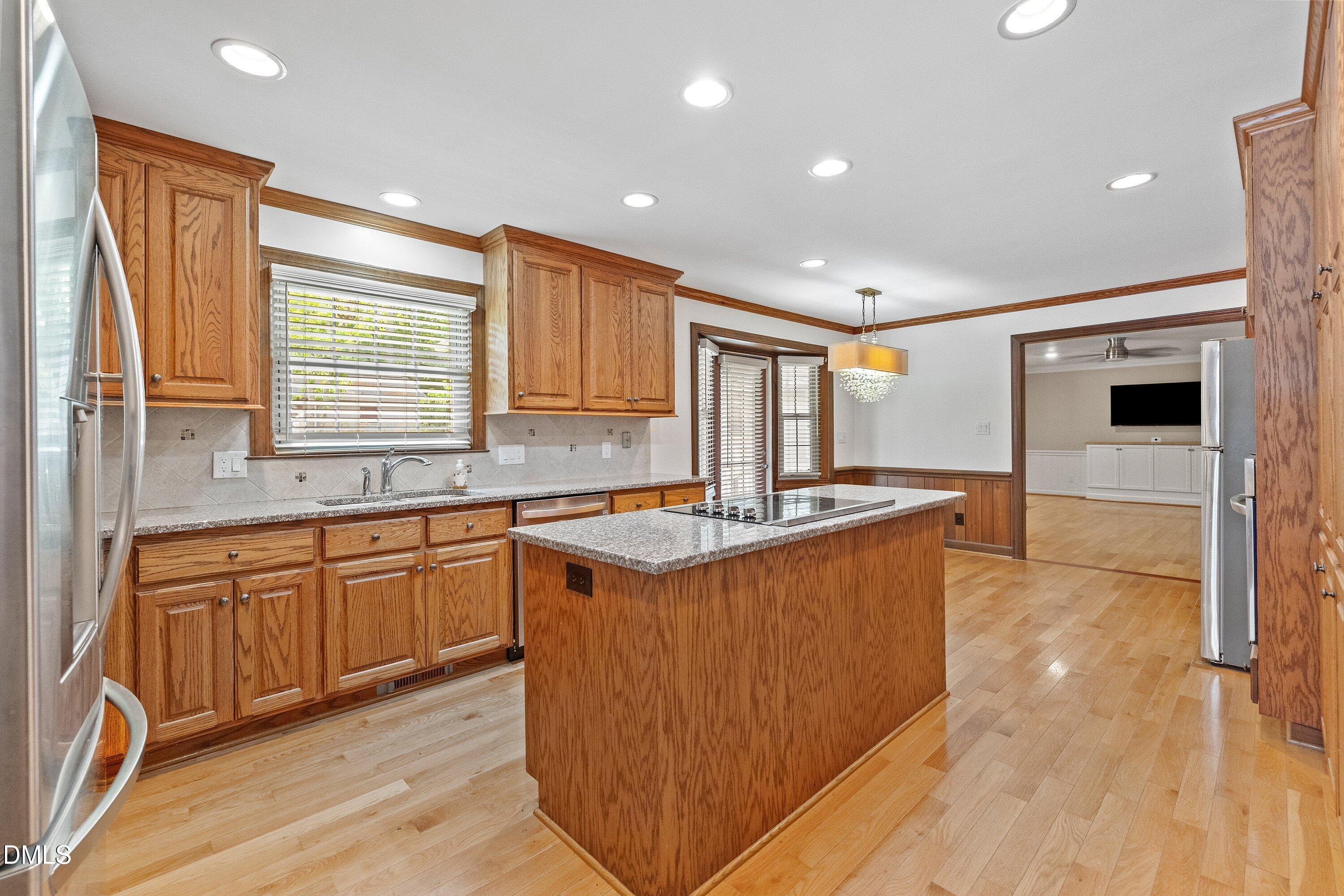 8133 Holly Forest Road Wake Forest, NC 27587 - Photo 10 of 50 a kitchen with stainless steel appliances granite countertop a stove and a sink