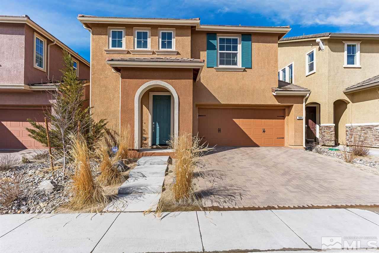 1965 Hope Valley Drive Reno, NV 89521 - Photo 1 of 17 a front view of a house with a yard