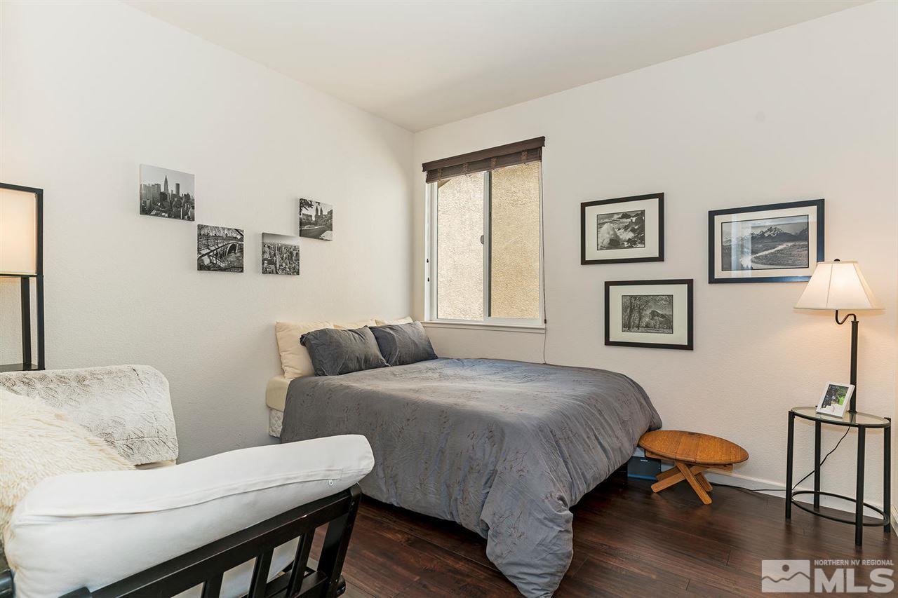 1965 Hope Valley Drive Reno, NV 89521 - Photo 11 of 17 a bedroom with a bed and wooden floor