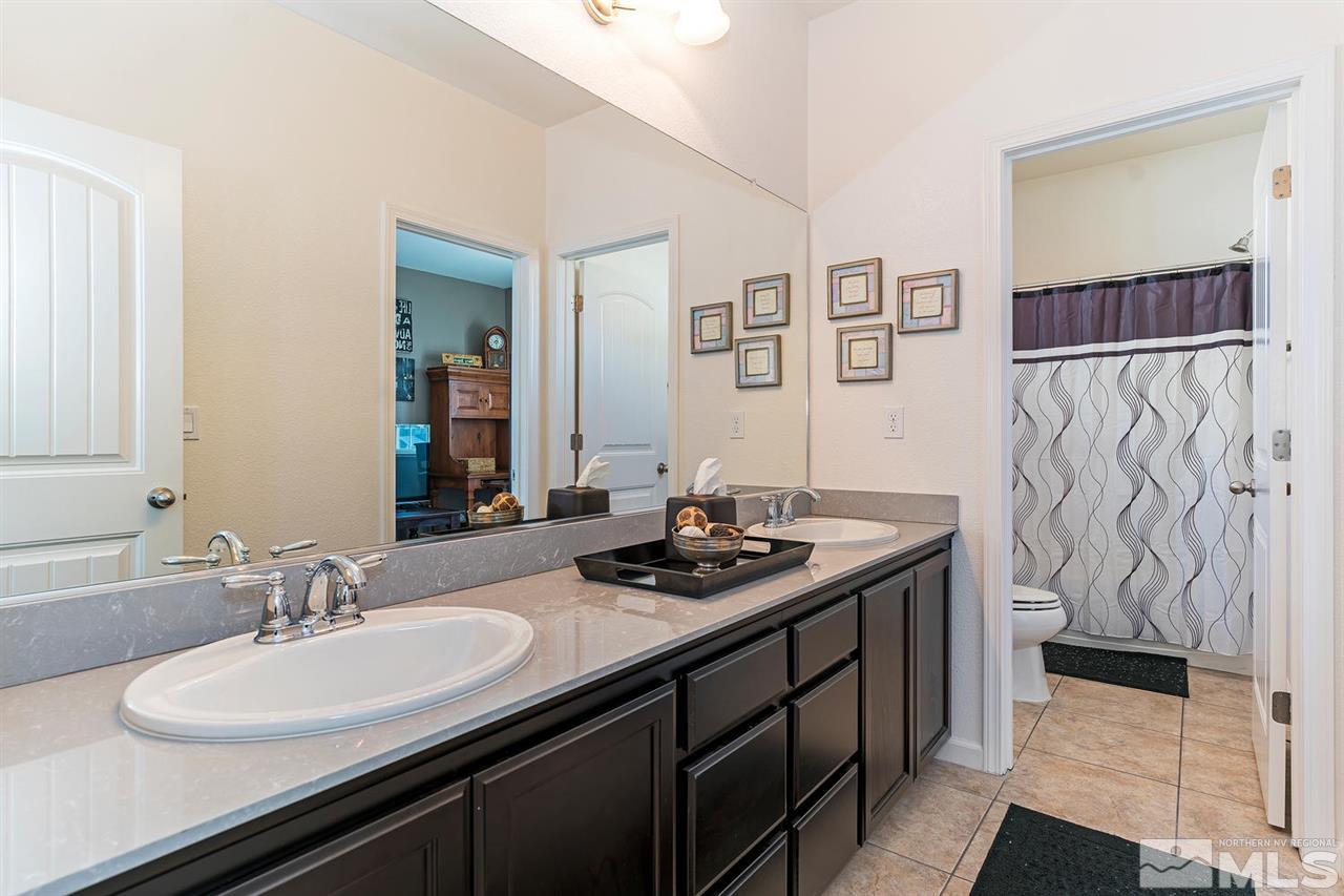 1965 Hope Valley Drive Reno, NV 89521 - Photo 13 of 17 a bathroom with a sink and a mirror
