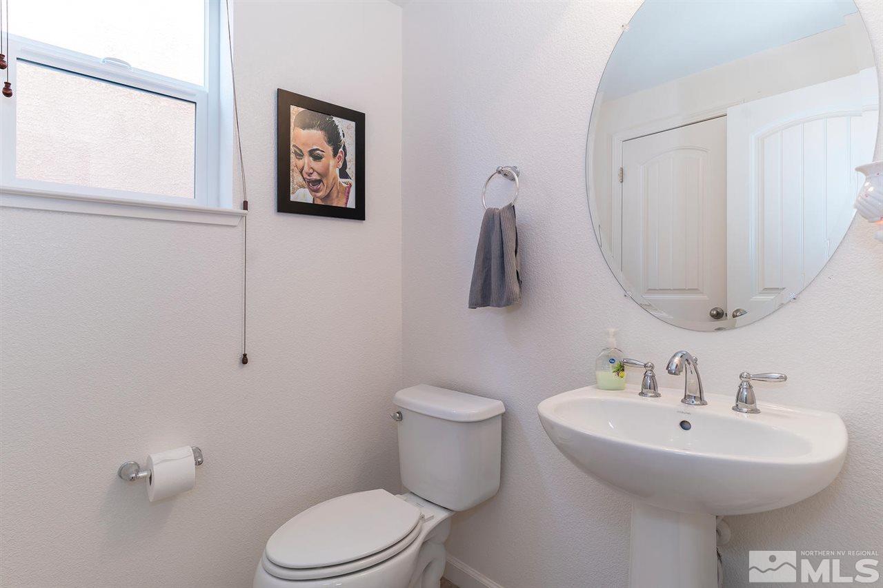 1965 Hope Valley Drive Reno, NV 89521 - Photo 15 of 17 a bathroom with a toilet sink and mirror