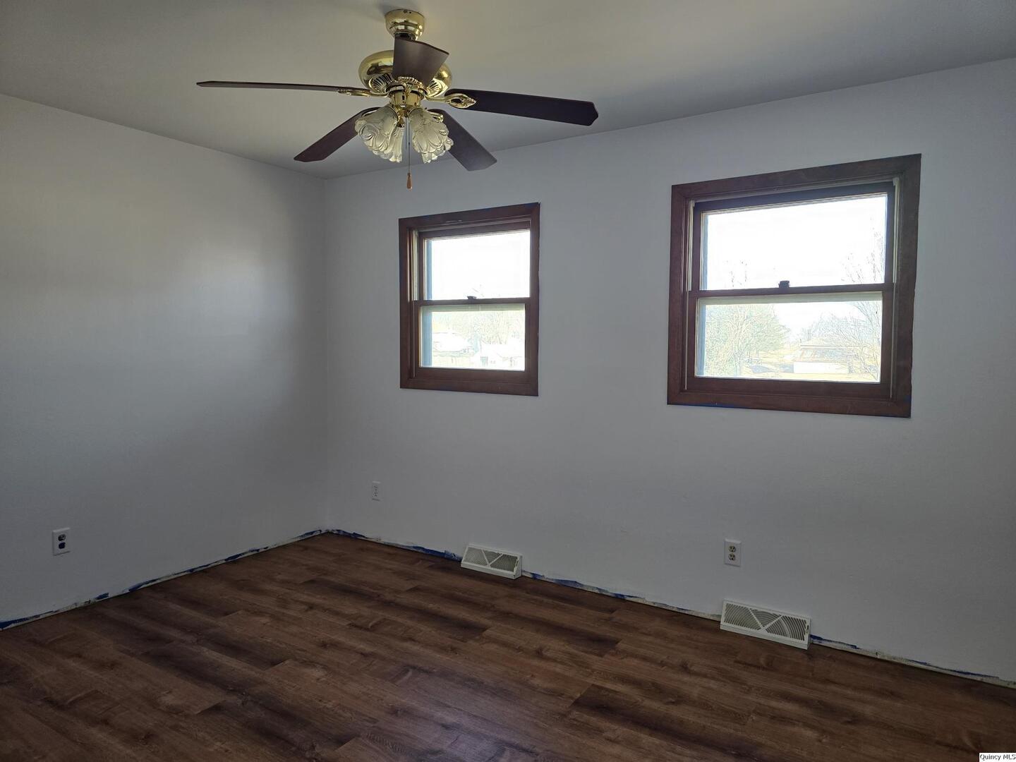 305 East 3rd Street Bowen, IL 62316 - Photo 14 of 32 a view of empty room with wooden floor and fan