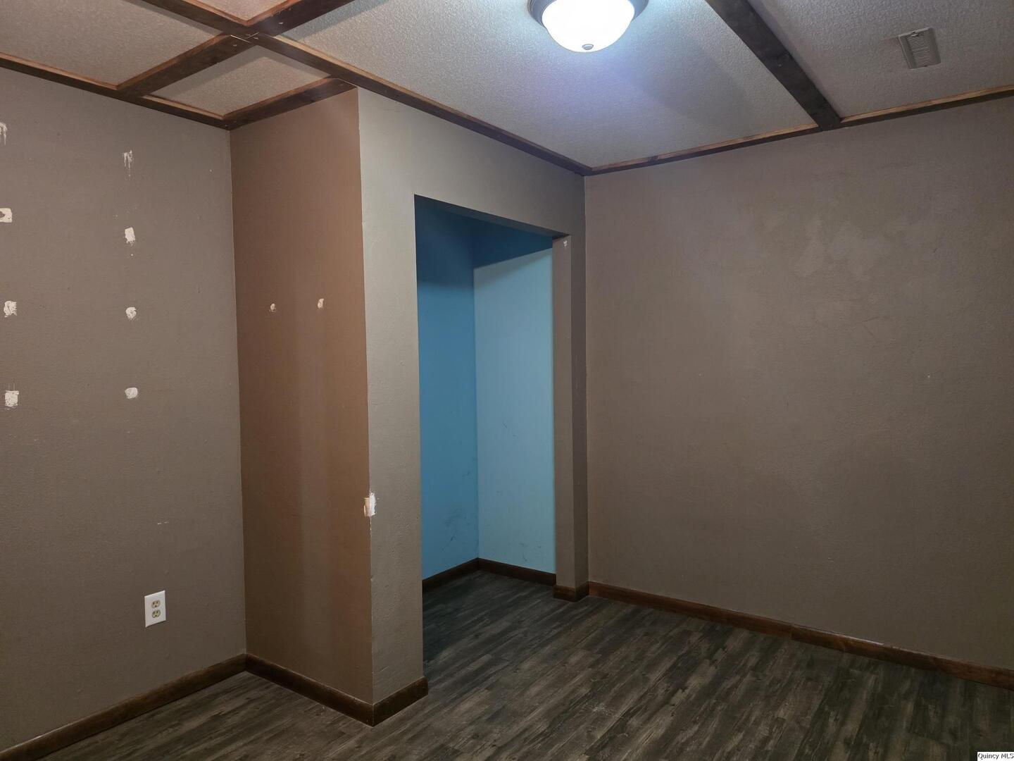 305 East 3rd Street Bowen, IL 62316 - Photo 19 of 32 a view of an empty room with wooden floor