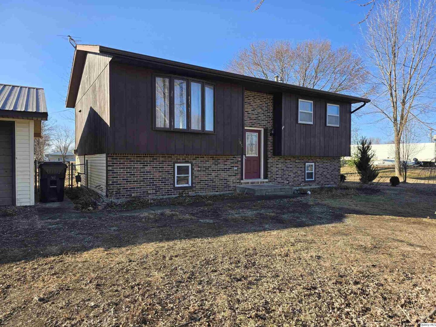 305 East 3rd Street Bowen, IL 62316 - Photo 24 of 32 a front view of a house with a yard
