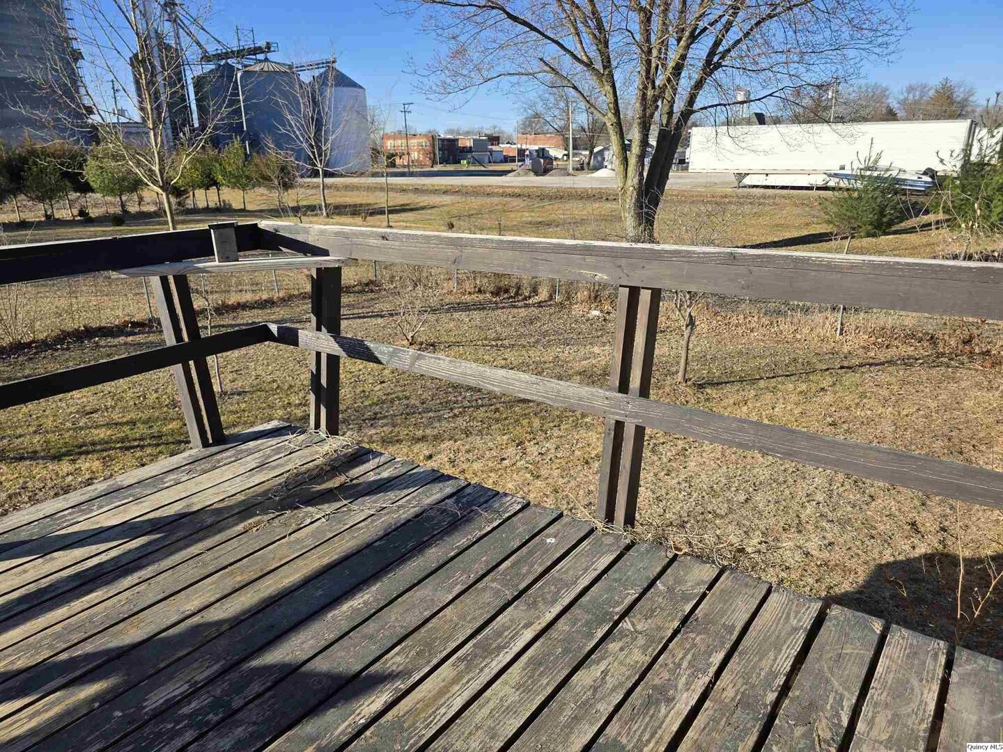 305 East 3rd Street Bowen, IL 62316 - Photo 29 of 32 a view of a balcony with wooden floor