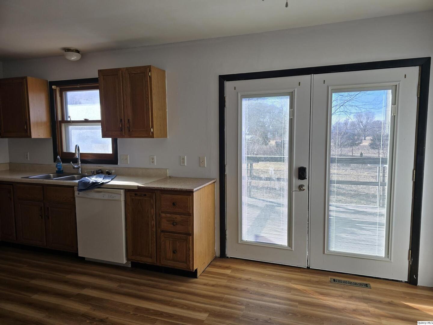 305 East 3rd Street Bowen, IL 62316 - Photo 7 of 32 a view of a granite countertop cabinets and a wooden floor