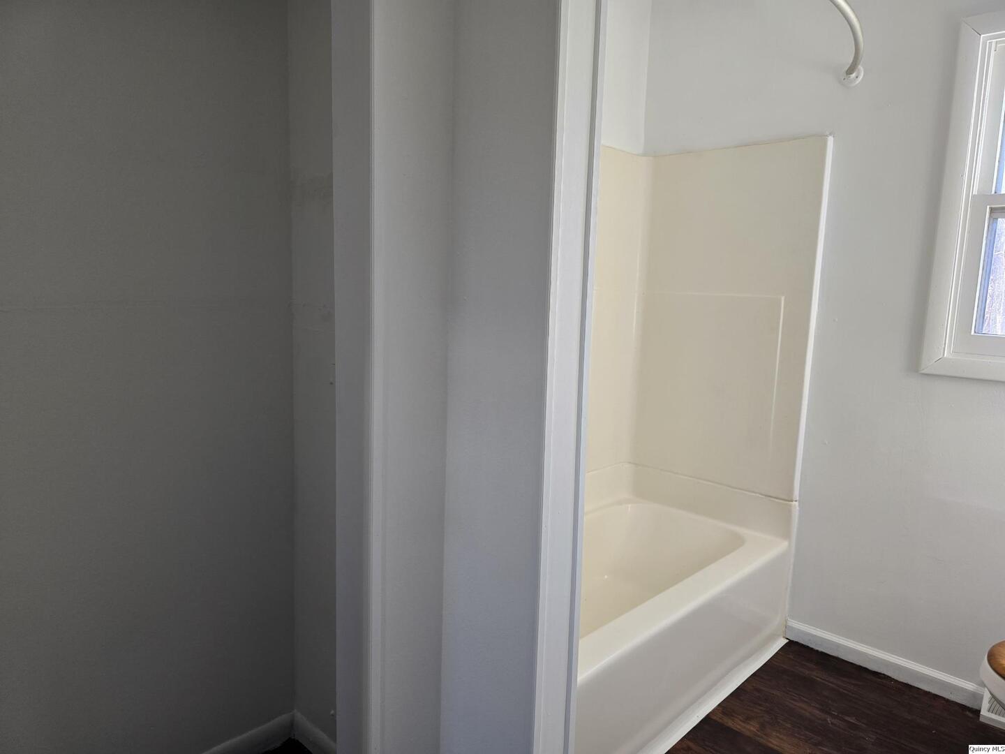 305 East 3rd Street Bowen, IL 62316 - Photo 10 of 32 a bath tub sitting next to a white sink