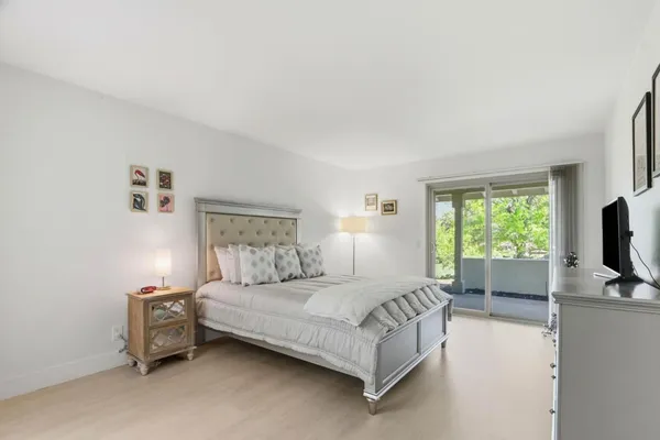 a bedroom with a bed and a couch