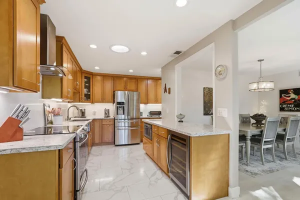 a kitchen with a sink a stove and cabinets