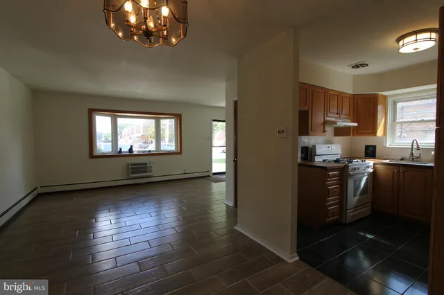 a view of a hallway with a wooden door