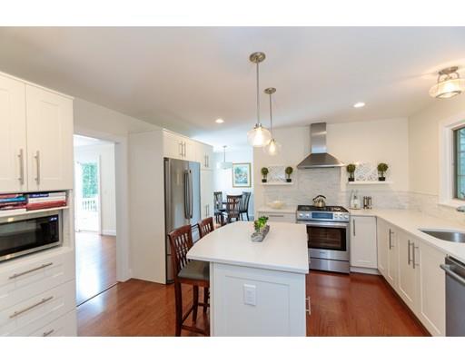 110 Albion Road Wellesley, MA 02481 - Photo 13 of 17 a kitchen with stainless steel appliances a stove a sink a refrigerator and cabinets