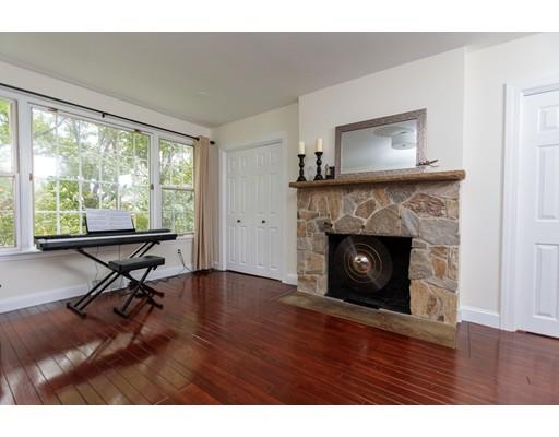 110 Albion Road Wellesley, MA 02481 - Photo 3 of 17 a living room with furniture and a fireplace