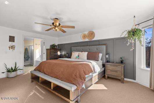 552 Spur Court Fernley, NV 89408 - Photo 24 of 46 a bedroom with a bed and a chandelier