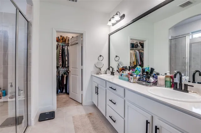 a bathroom with sink and mirror