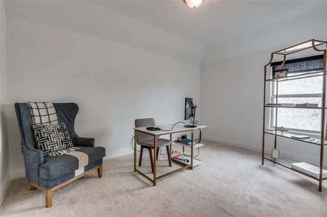a work room with furniture and a window