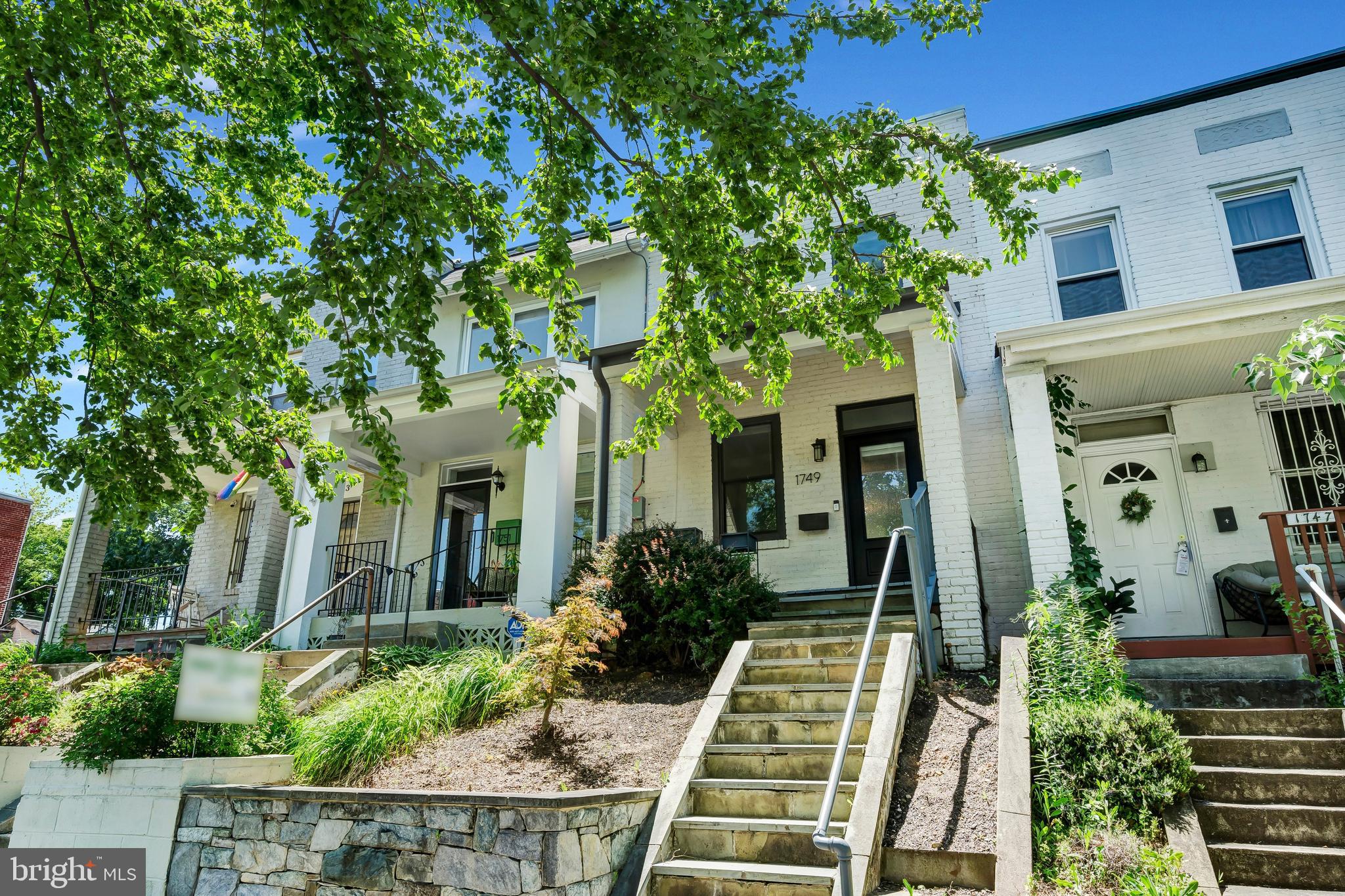 1749 L Street Northeast Washington, DC 20002 - Photo 1 of 24 a front view of a house with garden