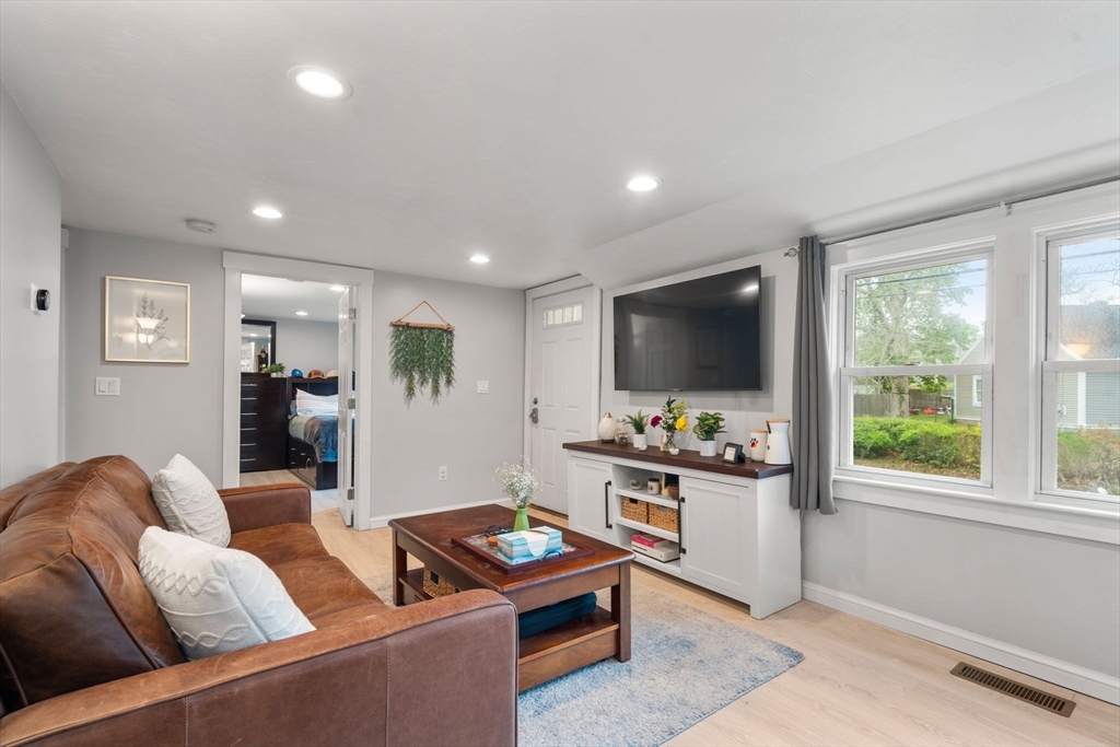 7 Indian Neck Road Wareham, MA 02571 - Photo 22 of 34 a living room with furniture and a flat screen tv