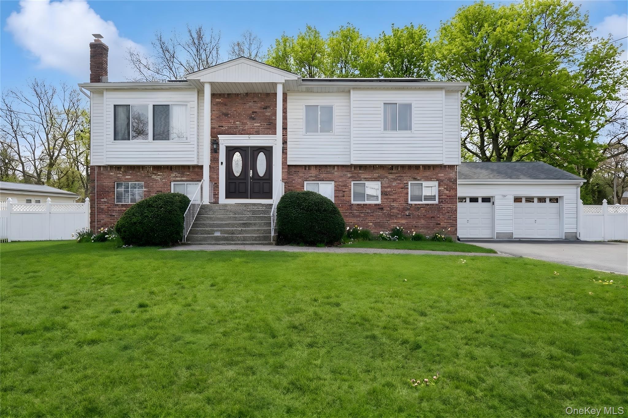 40 Scholar Lane Commack, NY 11725 - Photo 1 of 49 a view of a house with a garden