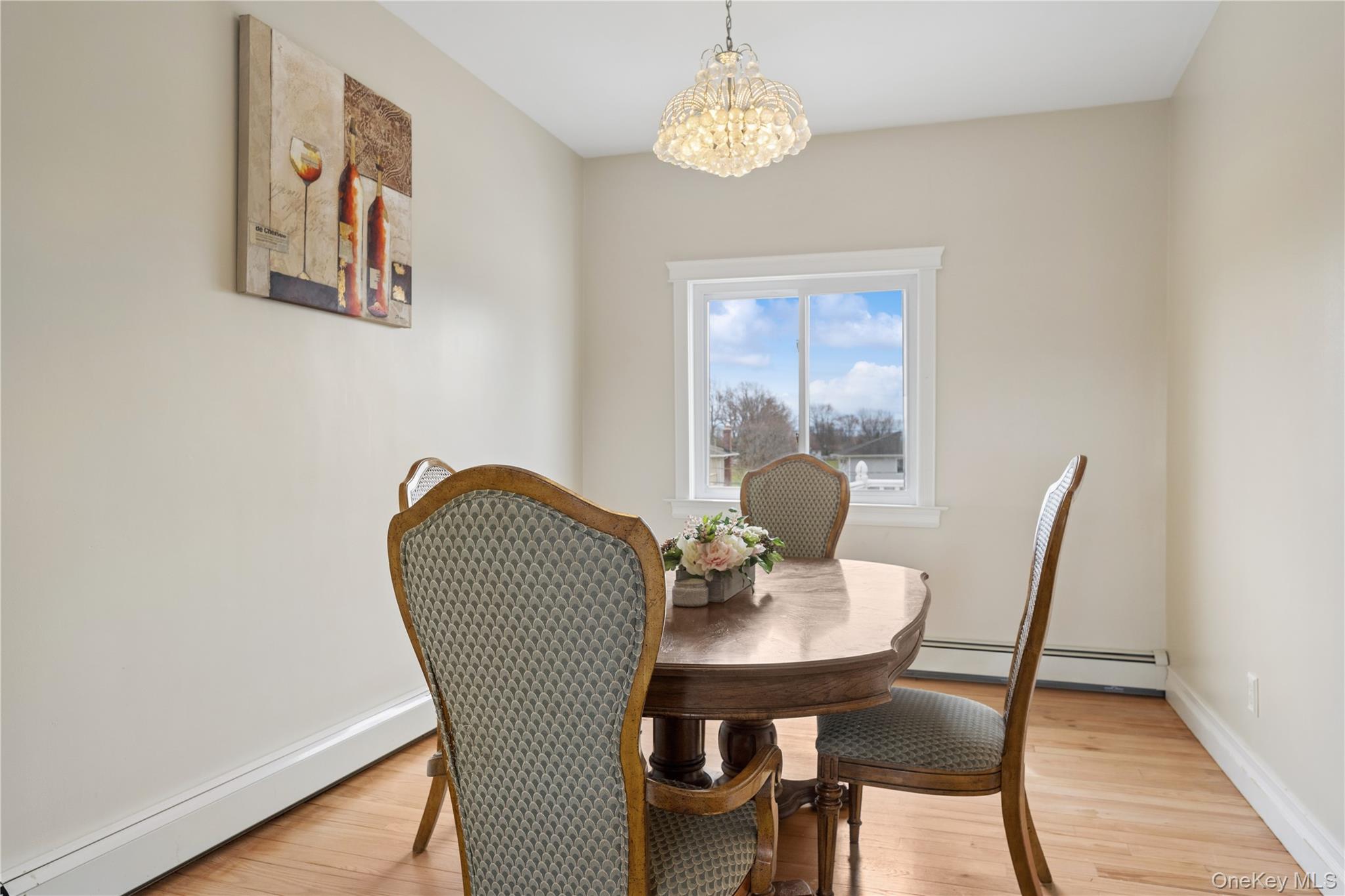 40 Scholar Lane Commack, NY 11725 - Photo 12 of 49 a view of a dining room with furniture wooden floor and chandelier