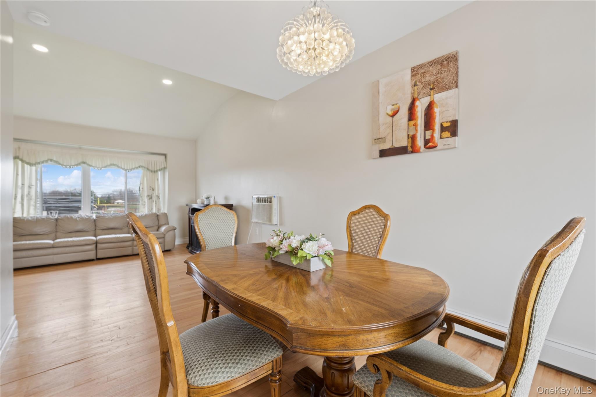 40 Scholar Lane Commack, NY 11725 - Photo 16 of 49 a view of a dining room with furniture and wooden floor