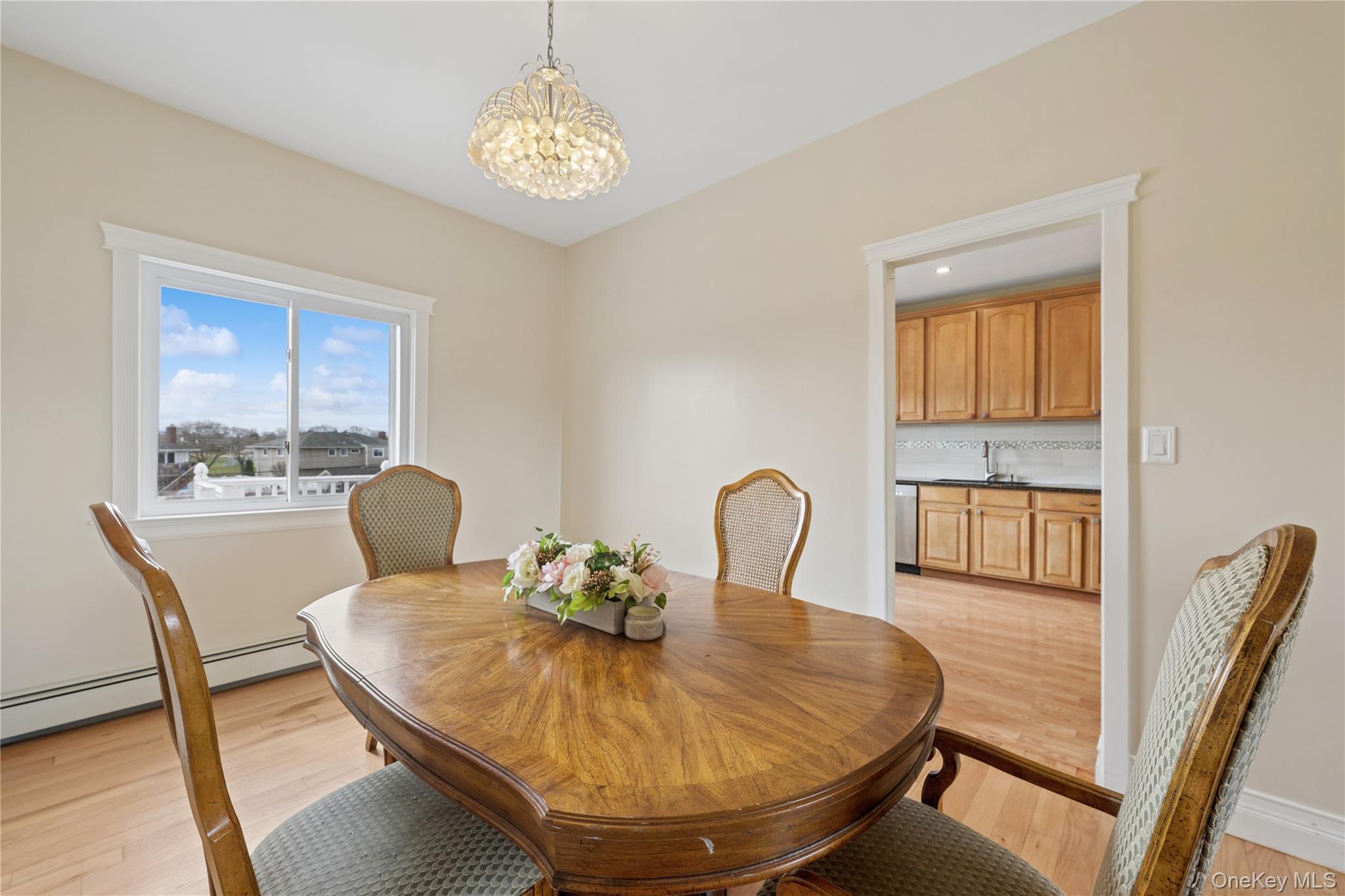 40 Scholar Lane Commack, NY 11725 - Photo 17 of 49 a view of a dining room with furniture window and wooden floor