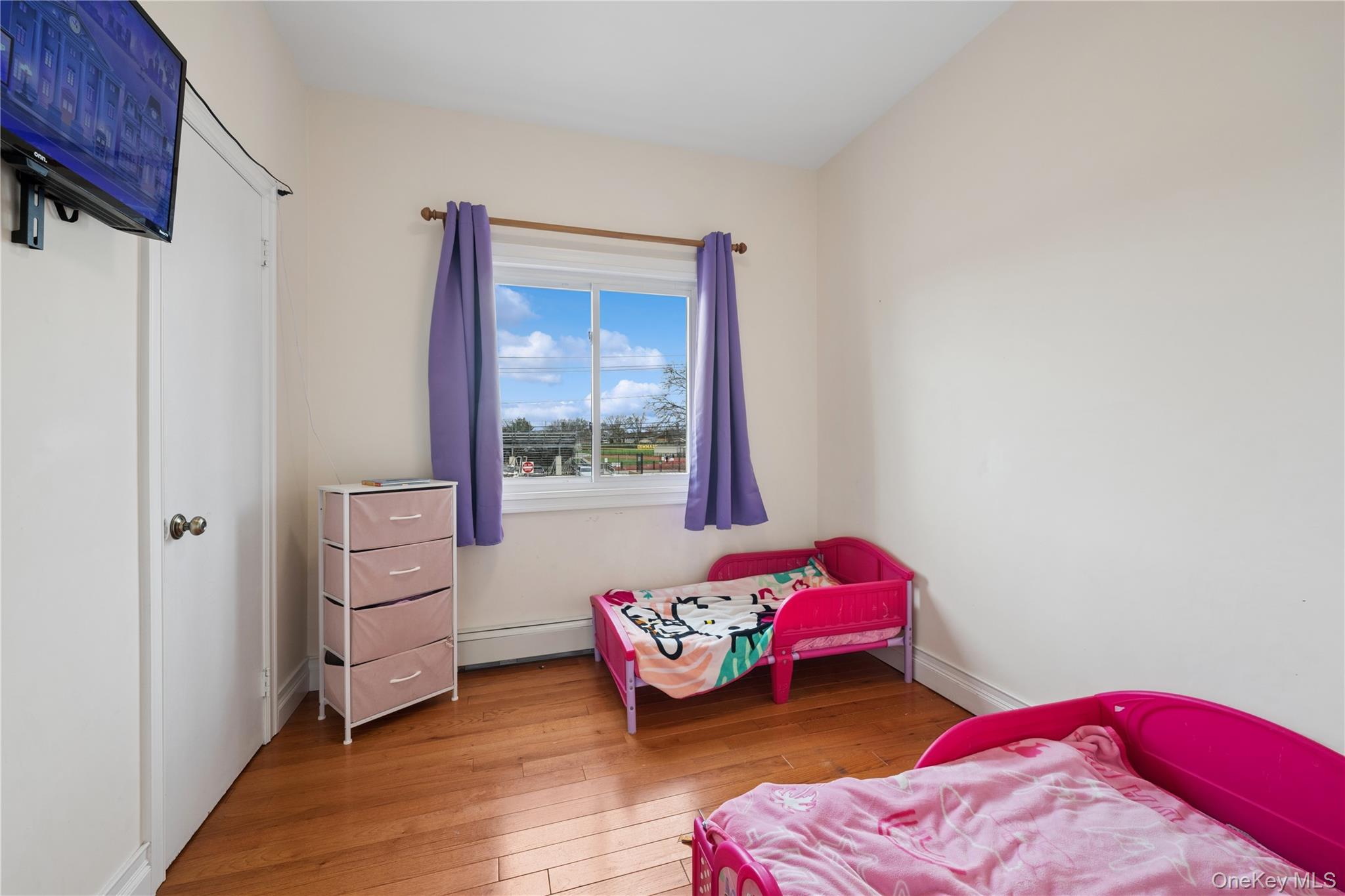 40 Scholar Lane Commack, NY 11725 - Photo 21 of 49 a bedroom with a bed and a window