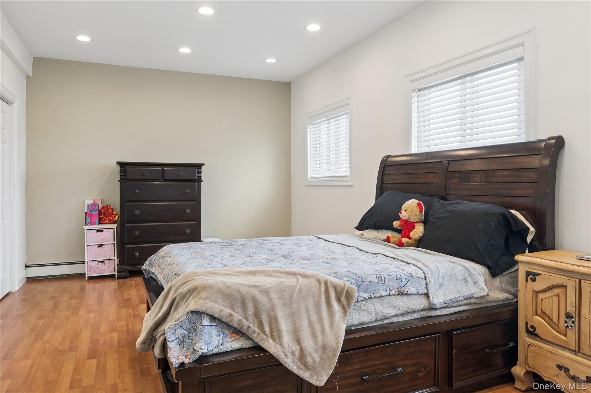 40 Scholar Lane Commack, NY 11725 - Photo 27 of 49 a bedroom with a bed and a closet
