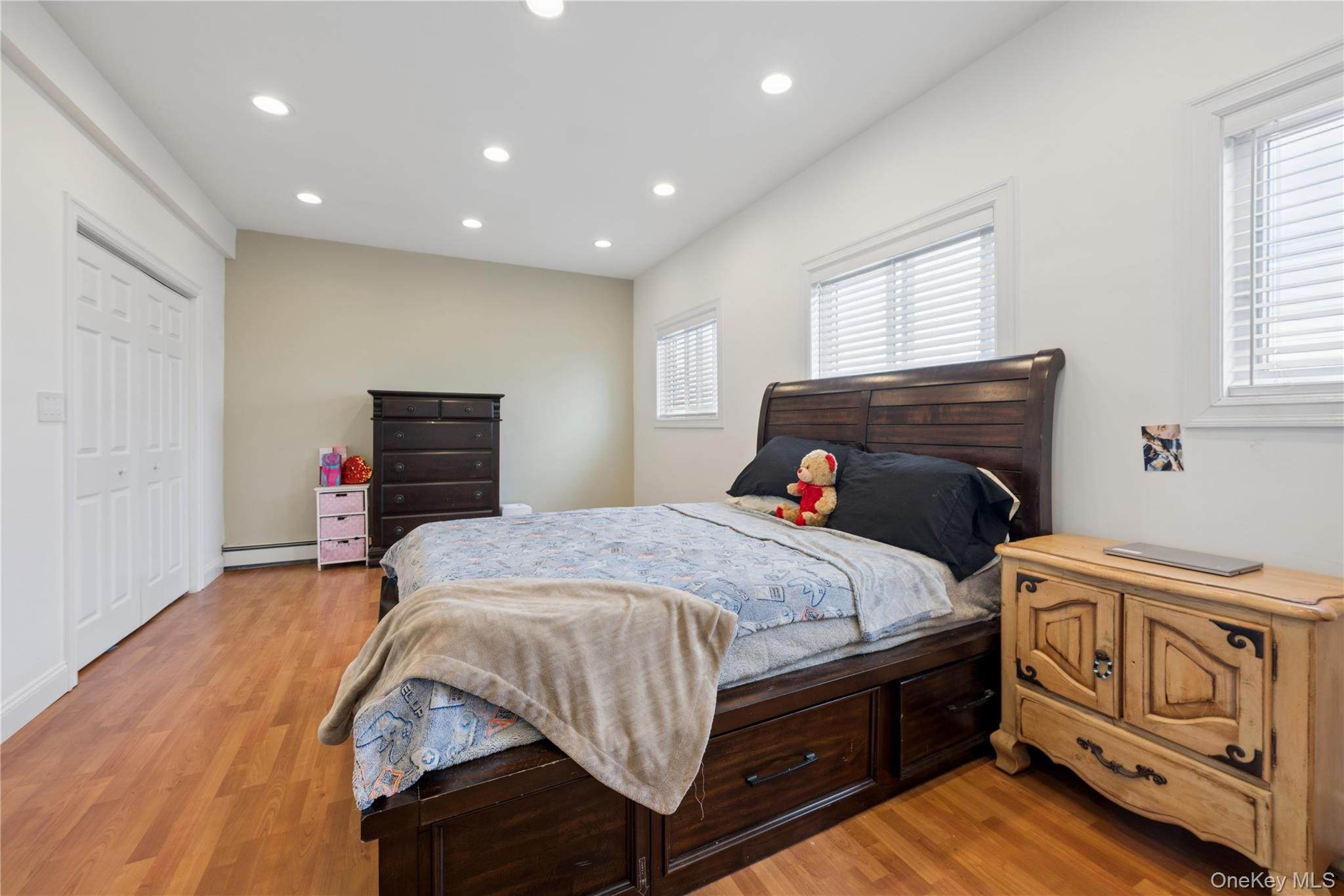 40 Scholar Lane Commack, NY 11725 - Photo 28 of 49 a bedroom with a bed and a tv