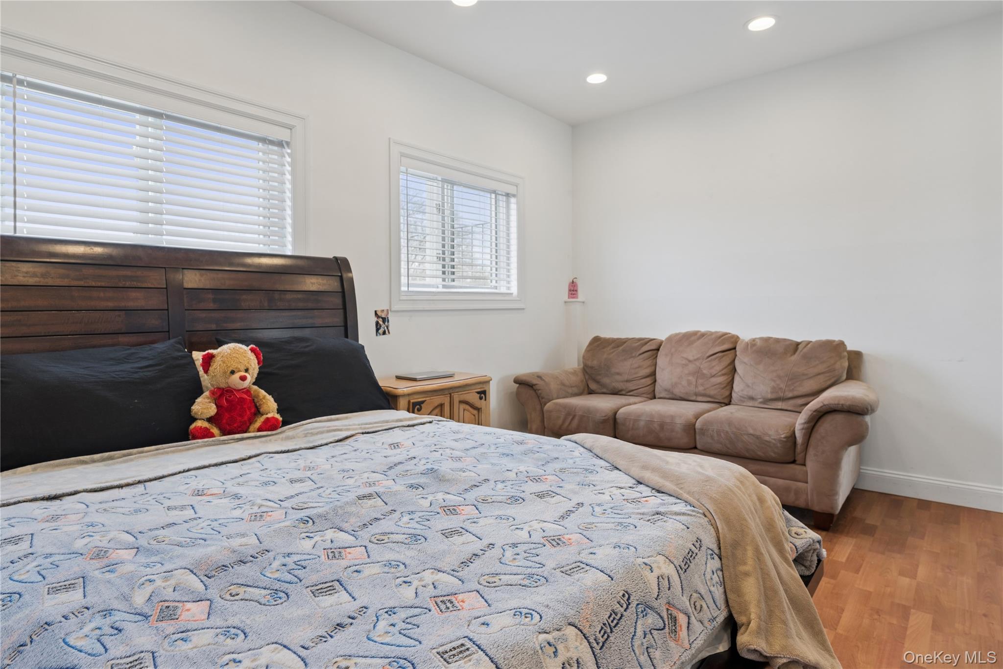40 Scholar Lane Commack, NY 11725 - Photo 29 of 49 a bed room with bed and a couch