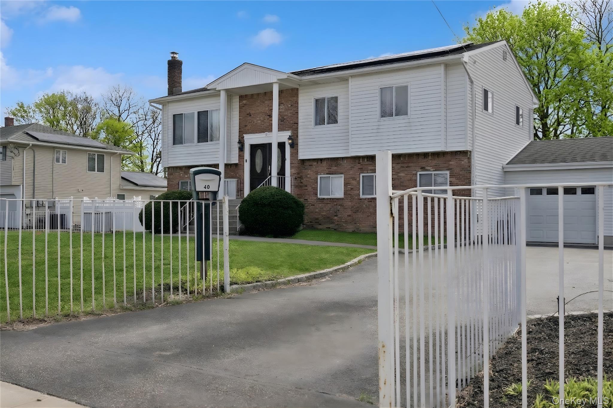 40 Scholar Lane Commack, NY 11725 - Photo 3 of 49 a view of a house with a yard and plants