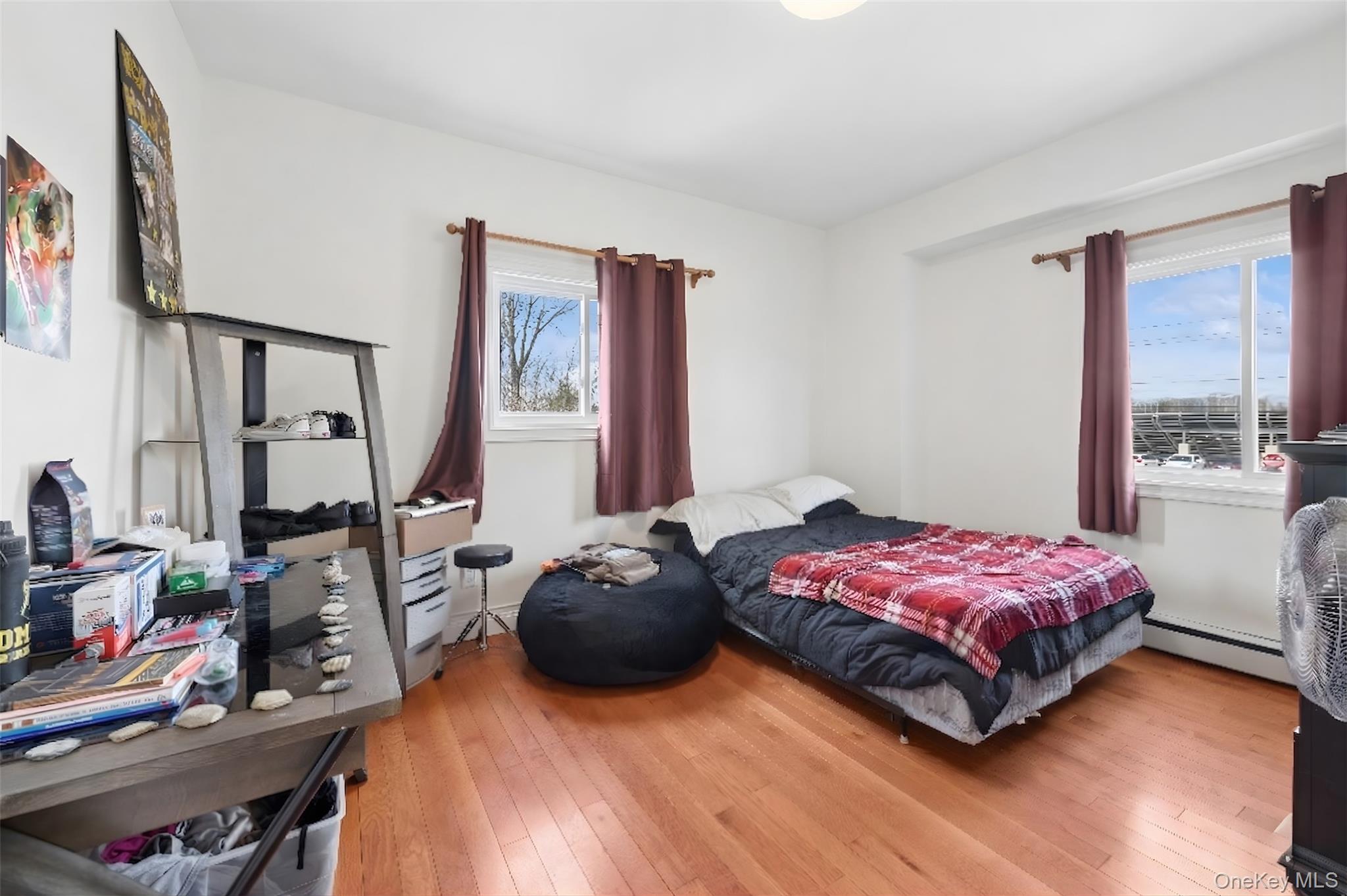 40 Scholar Lane Commack, NY 11725 - Photo 31 of 49 a bedroom with a bed window and dresser